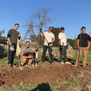 plumbing crew posing for a photo on the job